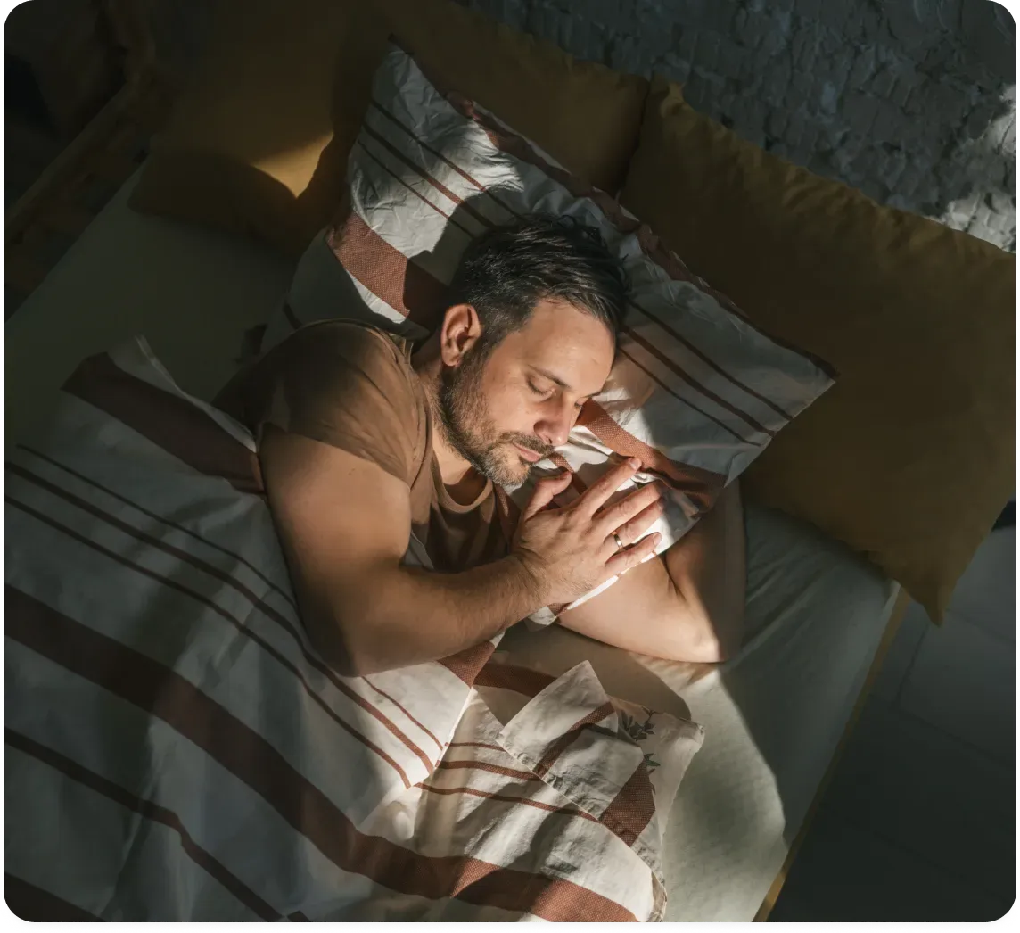 Man sleeping comfortably during a home sleep study